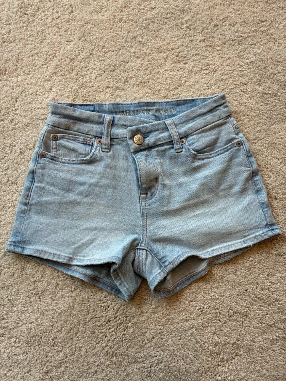 American Eagle Curvy High-Rise Shortie Stretch Jean Cross-Front Button Shorts - Picture 2 of 14